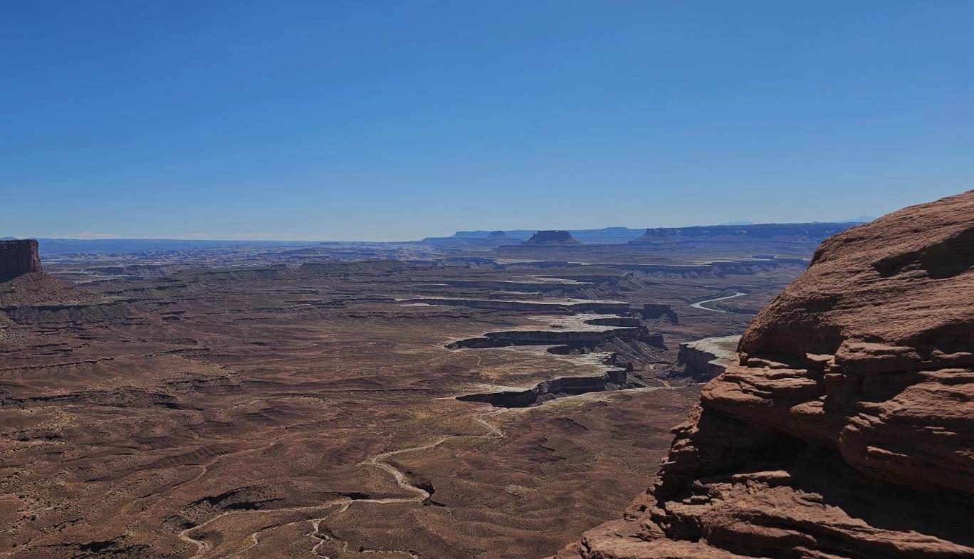 Aerial view of a canyon with a winding river — the route is not obvious